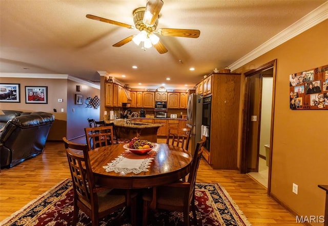 702 S 525th Rd, East Prairie, MO 63845 - dining space with light wood finished floors, ceiling fan, ornamental molding, recessed lighting, and baseboards