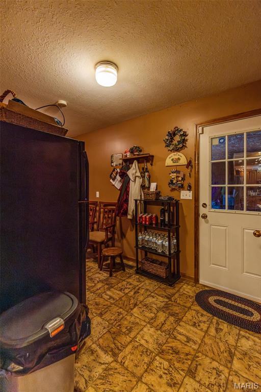 702 S 525th Rd, East Prairie, MO 63845 - foyer with a textured ceiling