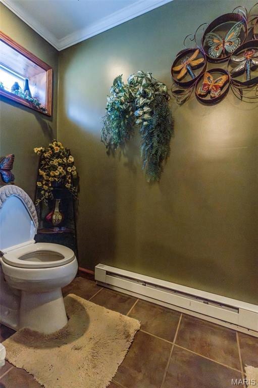 702 S 525th Rd, East Prairie, MO 63845 - bathroom featuring tile patterned flooring, ornamental molding, toilet, and a baseboard radiator