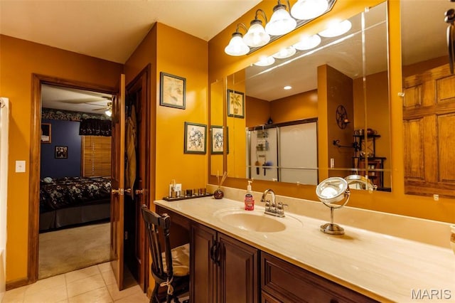 702 S 525th Rd, East Prairie, MO 63845 - ensuite bathroom with tile patterned floors, ceiling fan, vanity, and a shower