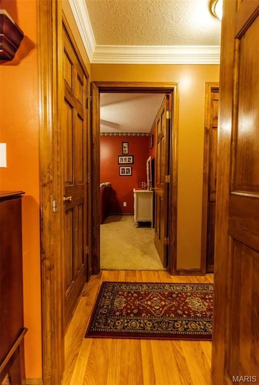 702 S 525th Rd, East Prairie, MO 63845 - hallway featuring ornamental molding and light wood-type flooring