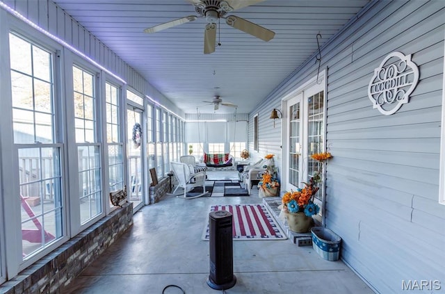 702 S 525th Rd, East Prairie, MO 63845 - sunroom featuring a ceiling fan, concrete flooring, an outdoor hangout area, and healthy amount of natural light