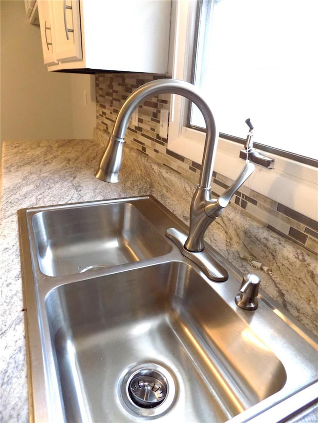 1306 Broadway St, Rolla, MO 65401 - kitchen view of a sink and tasteful backsplash