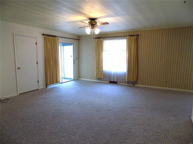 1306 Broadway St, Rolla, MO 65401 - carpeted spare room featuring a ceiling fan and baseboards