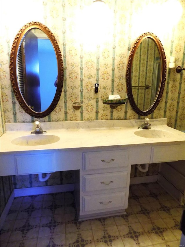 1306 Broadway St, Rolla, MO 65401 - bathroom featuring wallpapered walls and double vanity