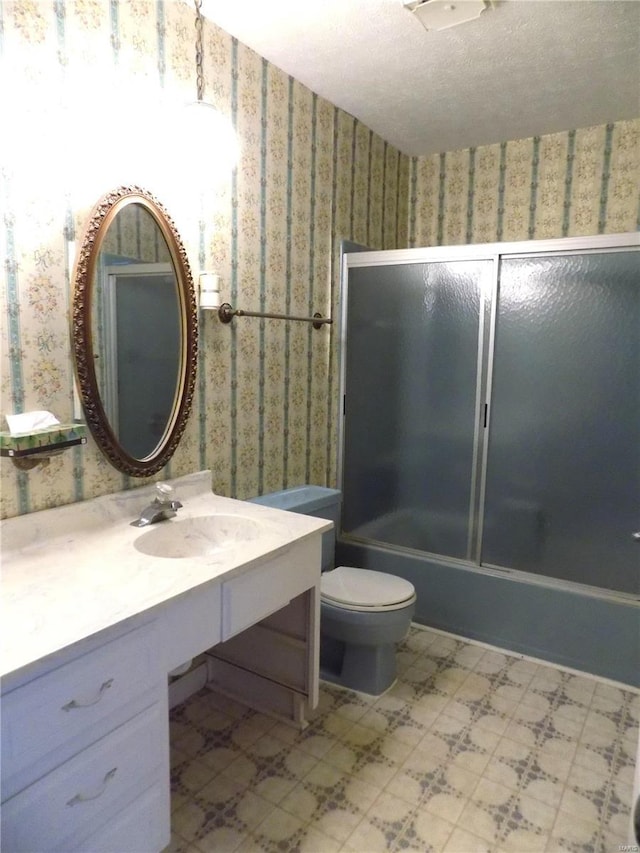 1306 Broadway St, Rolla, MO 65401 - full bathroom with wallpapered walls, tile patterned floors, vanity, toilet, and combined bath / shower with glass door