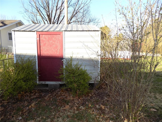 1306 Broadway St, Rolla, MO 65401 - view of shed featuring fence