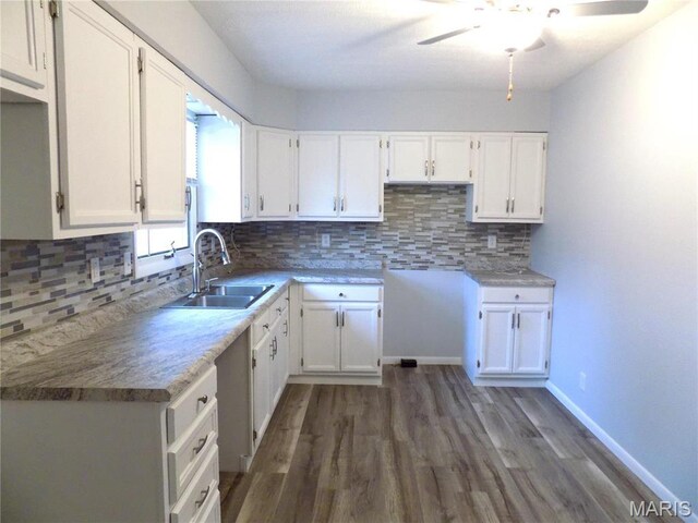 1306 Broadway St, Rolla, MO 65401 - kitchen featuring a sink, white cabinets, and ceiling fan