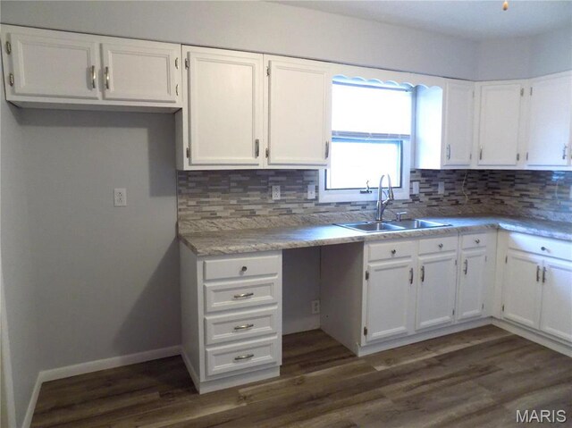 1306 Broadway St, Rolla, MO 65401 - kitchen with a sink, white cabinetry, backsplash, and dark wood-style floors