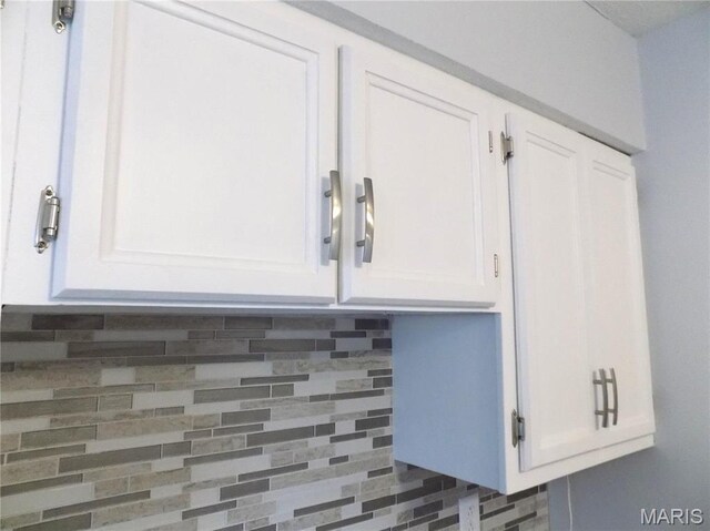 1306 Broadway St, Rolla, MO 65401 - kitchen view of white cabinetry and decorative backsplash