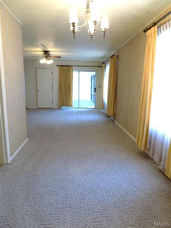 1306 Broadway St, Rolla, MO 65401 - unfurnished room with light colored carpet, a chandelier, ceiling fan, and baseboards
