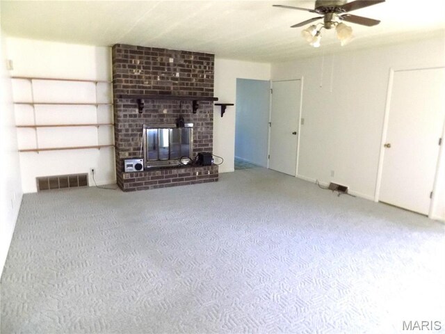 1306 Broadway St, Rolla, MO 65401 - unfurnished living room with a ceiling fan and a brick fireplace