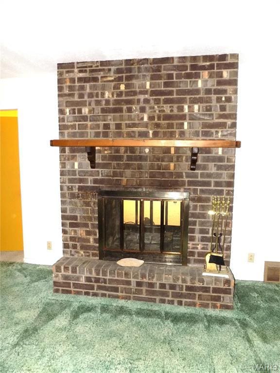 1306 Broadway St, Rolla, MO 65401 - detailed view of a brick fireplace and carpet floors