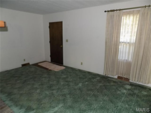 1306 Broadway St, Rolla, MO 65401 - empty room with carpet flooring