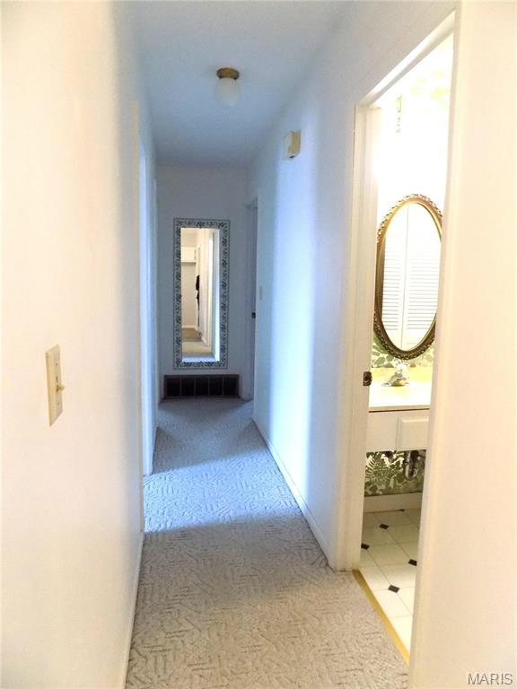 1306 Broadway St, Rolla, MO 65401 - hallway with carpet floors and baseboards