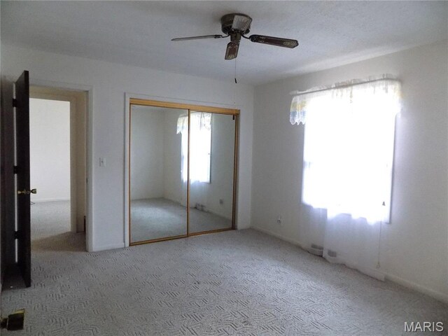 1306 Broadway St, Rolla, MO 65401 - unfurnished bedroom with carpet, a closet, and a ceiling fan