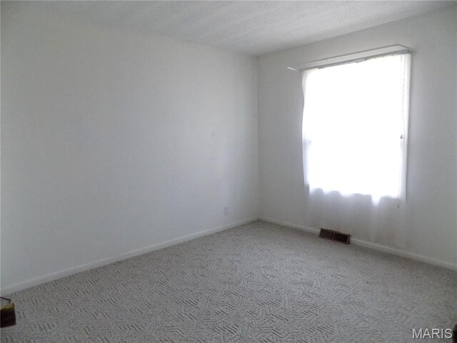 1306 Broadway St, Rolla, MO 65401 - carpeted empty room featuring baseboards