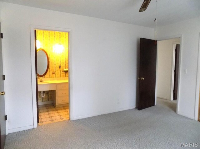 1306 Broadway St, Rolla, MO 65401 - unfurnished bedroom featuring carpet, a sink, and connected bathroom