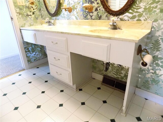 1306 Broadway St, Rolla, MO 65401 - bathroom featuring wallpapered walls and double vanity
