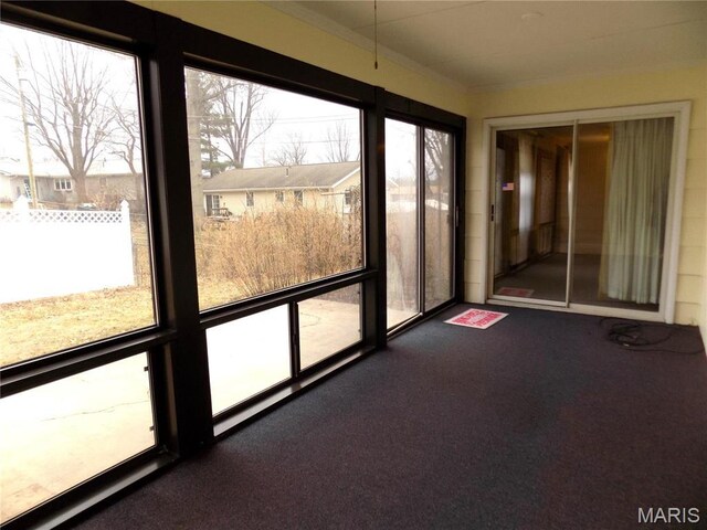 1306 Broadway St, Rolla, MO 65401 - unfurnished sunroom with healthy amount of natural light and carpet floors
