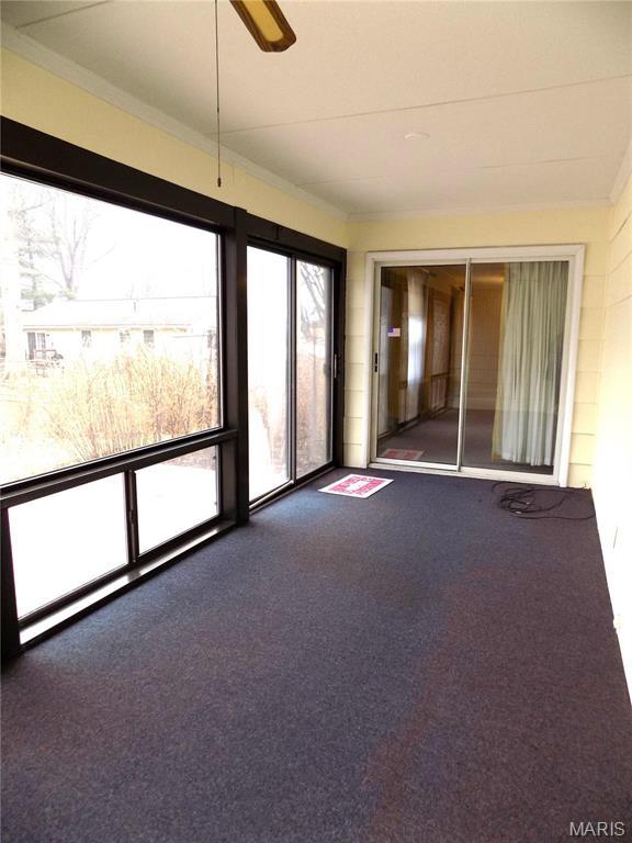 1306 Broadway St, Rolla, MO 65401 - unfurnished sunroom featuring carpet floors, a ceiling fan, and ornamental molding