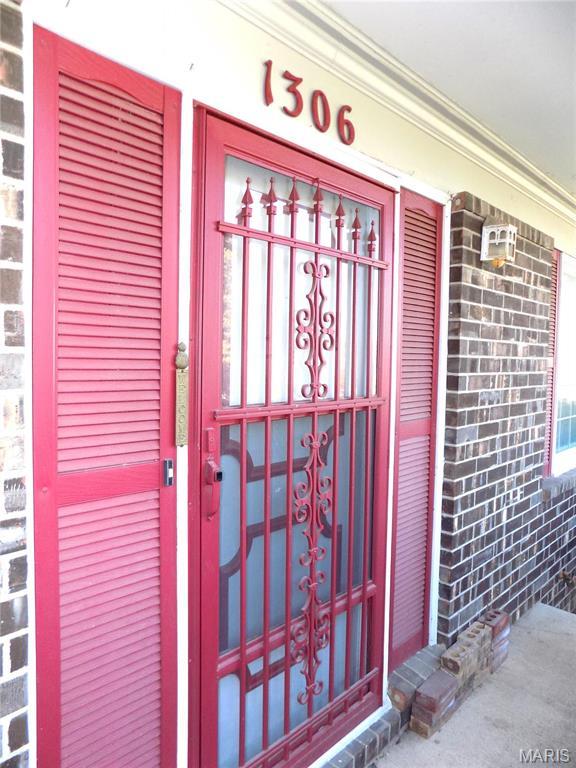 1306 Broadway St, Rolla, MO 65401 - property entrance featuring brick siding