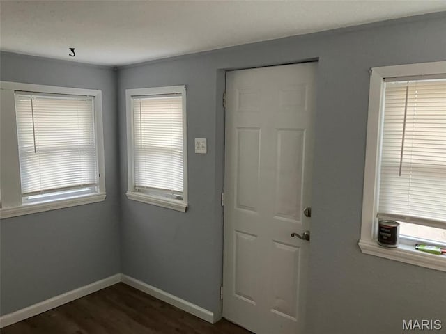 708 E Pear Ave, Owensville, MO 65066 - foyer featuring baseboards and dark wood-style flooring