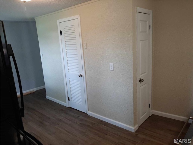 708 E Pear Ave, Owensville, MO 65066 - unfurnished bedroom featuring wood finished floors and baseboards