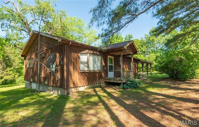 4117 State Highway 21, Grandin, MO 63943 - view of side of property featuring a lawn and board and batten siding