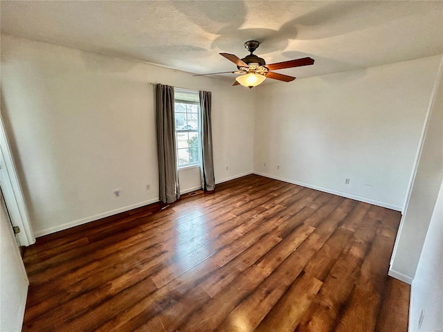 502 Mcclaren Way, Dixon, MO 65459 - empty room with ceiling fan, dark wood-style floors, and baseboards