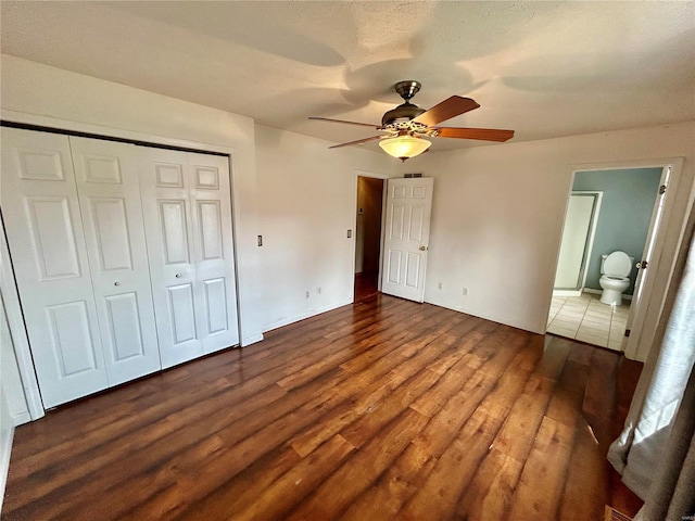 502 Mcclaren Way, Dixon, MO 65459 - unfurnished bedroom with wood finished floors, a closet, a ceiling fan, and baseboards