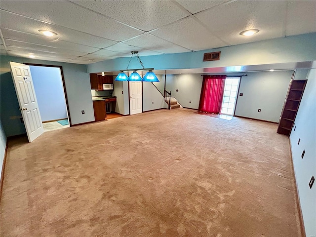 502 Mcclaren Way, Dixon, MO 65459 - basement featuring a paneled ceiling, baseboards, light carpet, and stairs