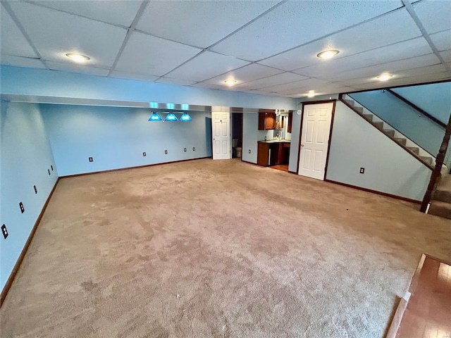 502 Mcclaren Way, Dixon, MO 65459 - finished below grade area featuring light carpet, baseboards, and a drop ceiling