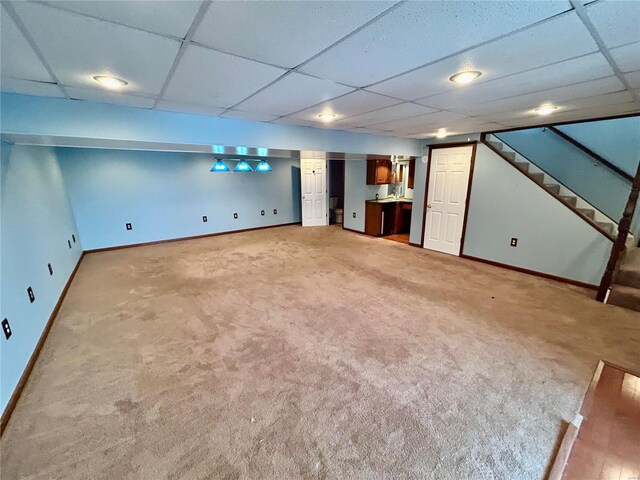 502 Mcclaren Way, Dixon, MO 65459 - finished basement with baseboards, light carpet, and a paneled ceiling