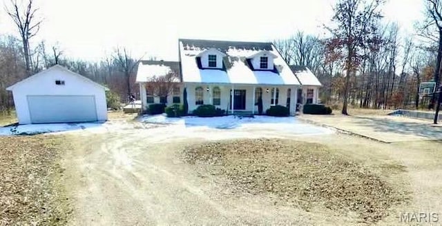 792 County Road 466, Poplar Bluff, MO 63901 - view of front of property with covered porch, a detached garage, and an outbuilding