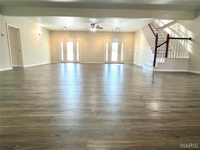 792 County Road 466, Poplar Bluff, MO 63901 - unfurnished living room with dark wood-type flooring, stairs, a ceiling fan, and baseboards