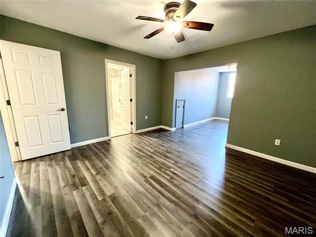 792 County Road 466, Poplar Bluff, MO 63901 - unfurnished bedroom with wood finished floors, baseboards, and a ceiling fan