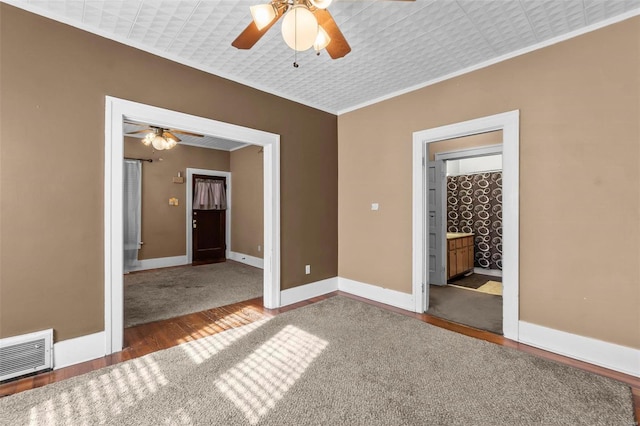604 N Fountain St, Cape Girardeau, MO 63701 - unfurnished room featuring a ceiling fan, wood finished floors, baseboards, and ornamental molding
