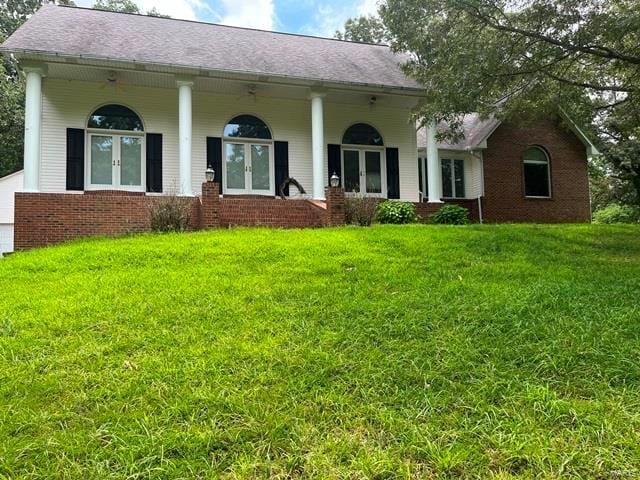 15800 State Highway Ad, Dexter, MO 63841 - back of property with french doors, brick siding, a yard, and a porch