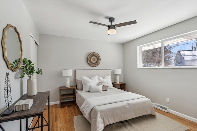 11567 Joslyn Ct, Saint Louis, MO 63138 - bedroom featuring wood finished floors and baseboards