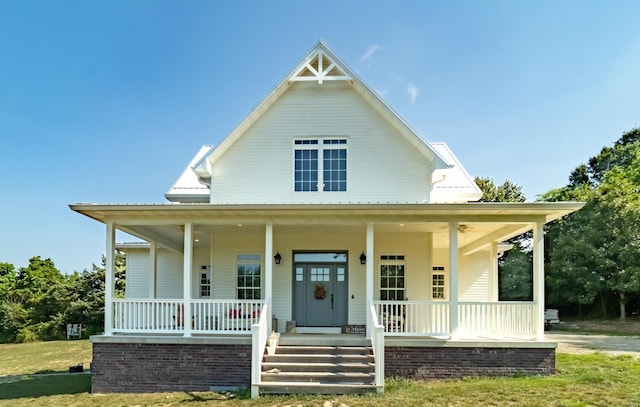 view of front of house with covered porch and metal roof