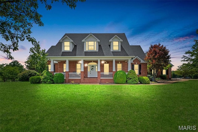 850 Aj Farm Ln, Washington, MO 63090 - view of front of house featuring covered porch, a yard, and brick siding
