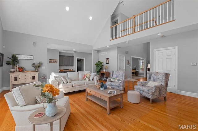 850 Aj Farm Ln, Washington, MO 63090 - living area featuring high vaulted ceiling, light wood-style flooring, baseboards, and recessed lighting