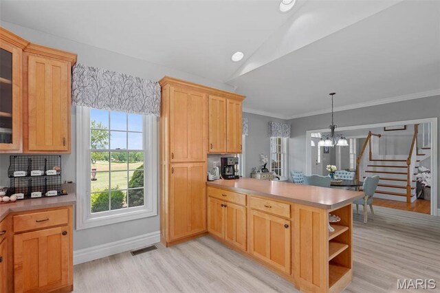850 Aj Farm Ln, Washington, MO 63090 - kitchen featuring a peninsula, light wood-style floors, a chandelier, glass insert cabinets, and lofted ceiling
