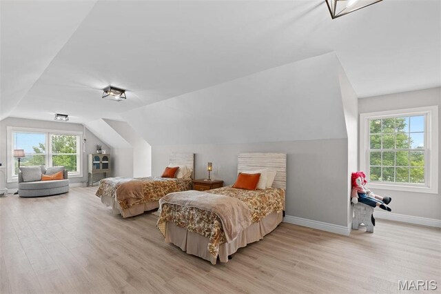 850 Aj Farm Ln, Washington, MO 63090 - bedroom featuring light wood-type flooring, lofted ceiling, and baseboards