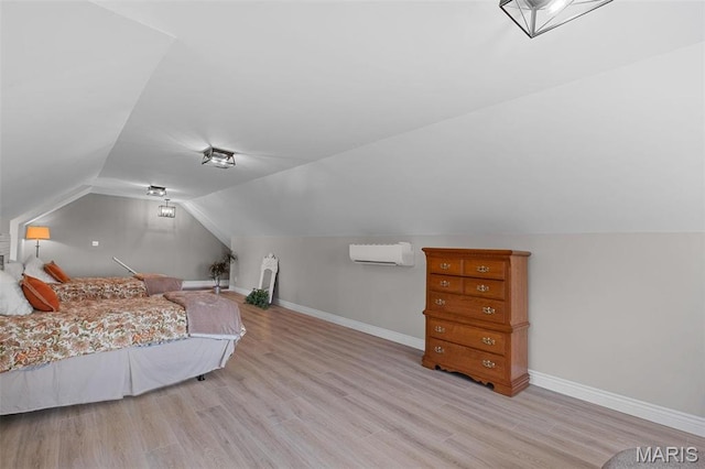 850 Aj Farm Ln, Washington, MO 63090 - bedroom with a wall unit AC, baseboards, wood finished floors, and lofted ceiling