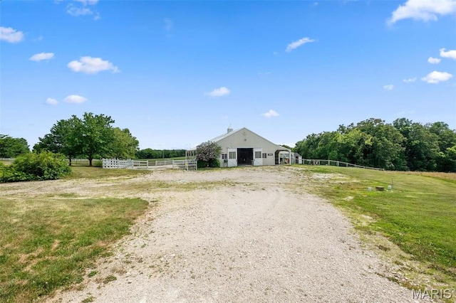 850 Aj Farm Ln, Washington, MO 63090 - view of front of house featuring a detached garage, fence, a view of rural / pastoral area, and an outdoor structure