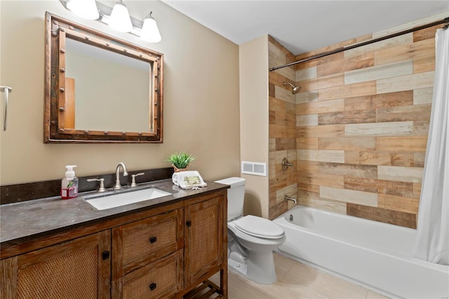 bathroom featuring shower / bathtub combination with curtain, toilet, vanity, and tile patterned floors