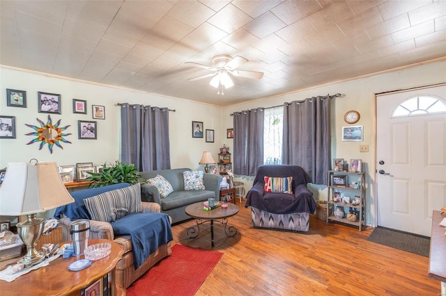 98 Ripley 160w-2, Doniphan, MO 63935 - living area featuring wood finished floors, a ceiling fan, and crown molding