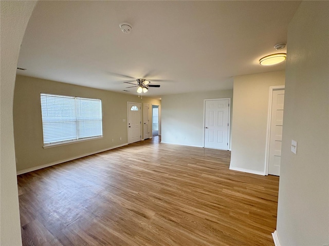 813 Breeze Ct, Perryville, MO 63775 - unfurnished living room featuring a ceiling fan, light wood-style flooring, and baseboards
